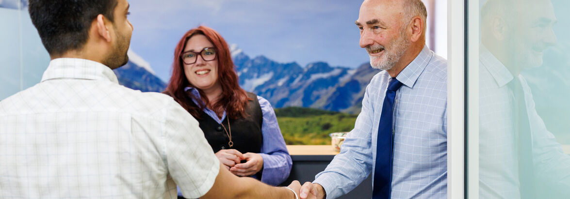 The Job Check Shaking hands in the Pathways office