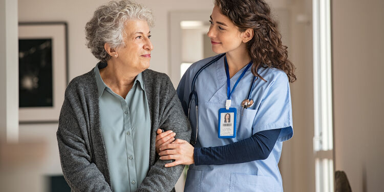 Caregiver Assist Senior Woman at Home