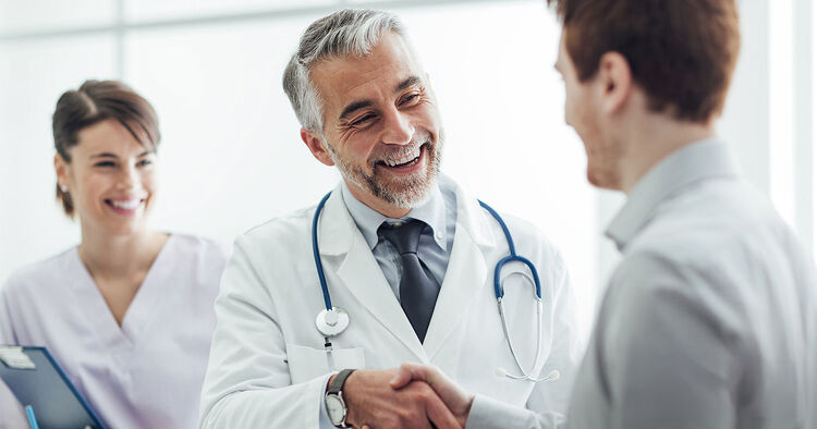 Doctor shaking hands with a patient