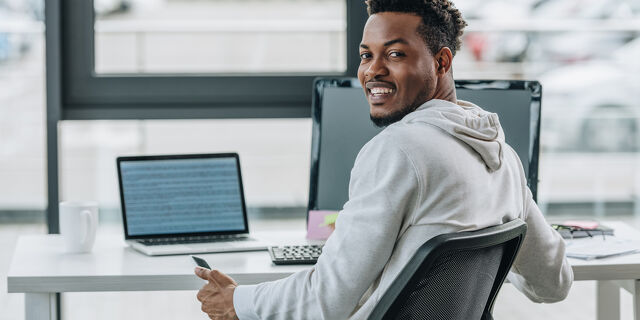 Happy African American Programmer Smiling