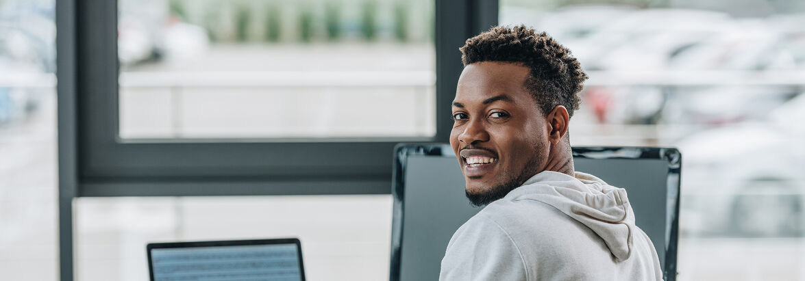 Employer Accreditation Renewal Happy African American Programmer Smiling