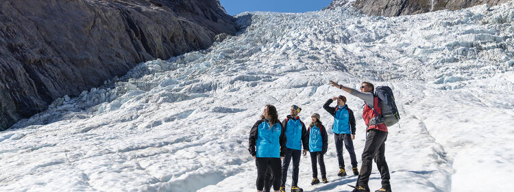 People exploring a snow-covered mountain