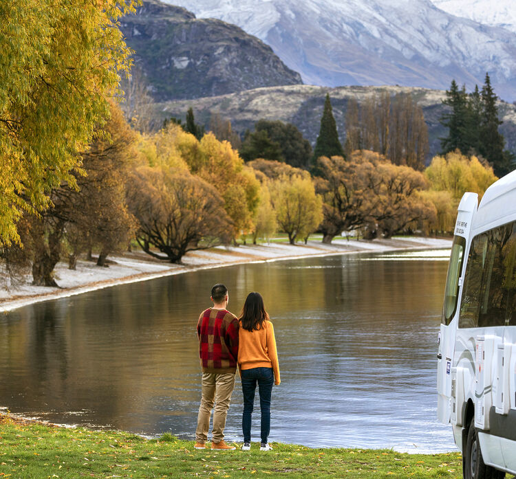 Couple standing by a lake