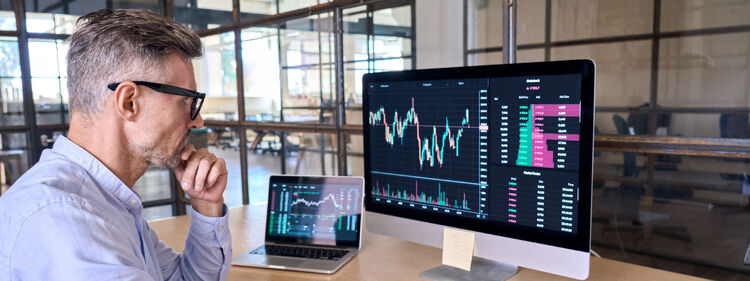 Man analyzing statistics on a computer